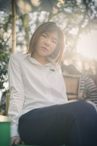 Young woman sitting on seat