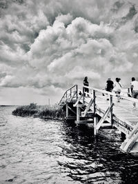 Pier over sea against sky