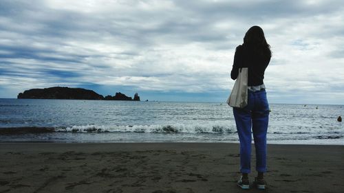 Scenic view of sea against cloudy sky