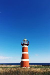 Lighthouse against clear blue sky