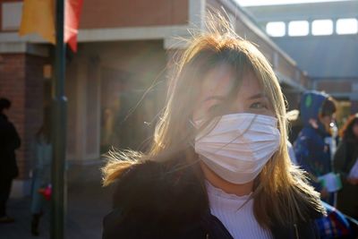 Portrait of young woman wearing mask