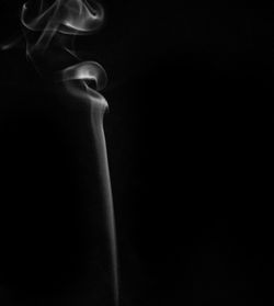 Close-up of cigarette against black background