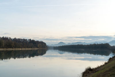 Scenic view of lake against sky during sunset