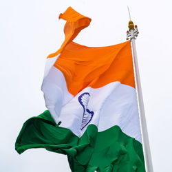 India flag flying high at connaught place with pride in blue sky, india flag fluttering, indian flag