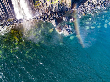 High angle view of rocks in sea