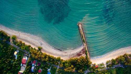 High angle view of trees by sea