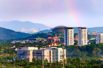 Buildings in city against sky