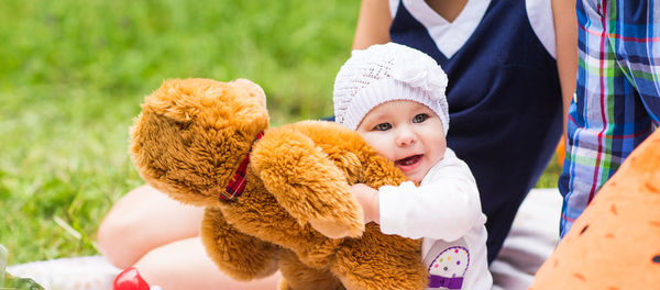 Cute girl holding stuffed toy