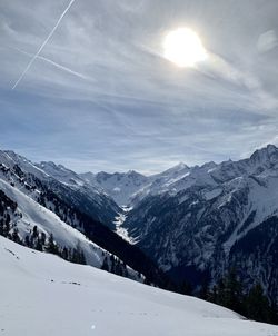 Scenic view of snowcapped mountains against sky