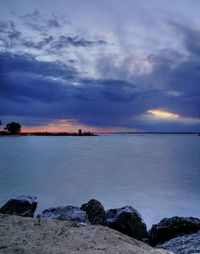 Scenic view of sea against cloudy sky