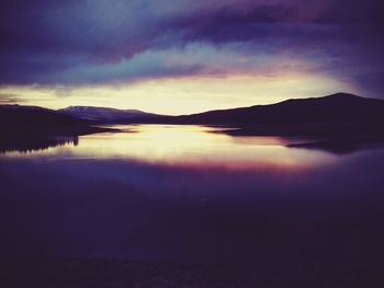 Scenic view of calm lake against sky