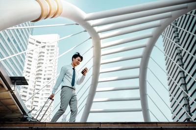 Low angle view of man standing on staircase