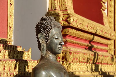 Statue of buddha outside building