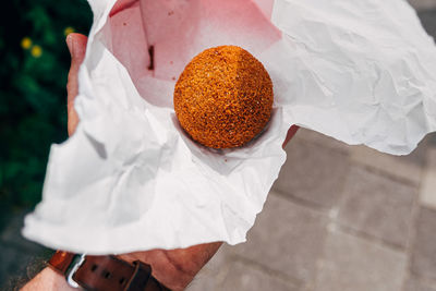 High angle view of man holding ice cream