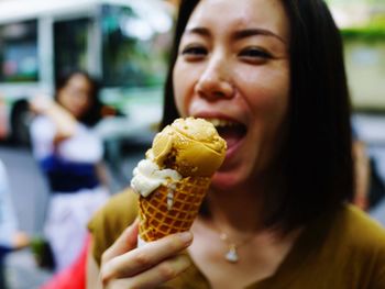 Portrait of woman having ice cream cone