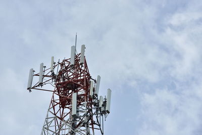 Low angle view of communications tower against sky