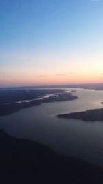 Scenic view of river at sunset