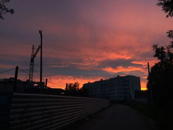 Silhouette of buildings against sky during sunset