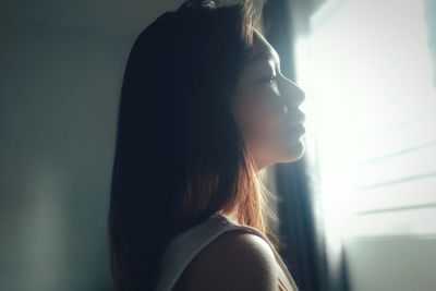 Portrait of young woman looking away