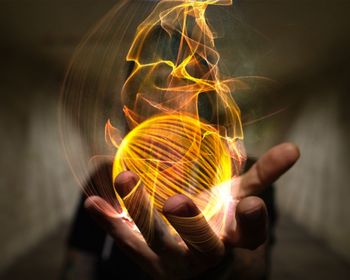 Digital composite of man holding fire