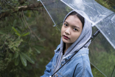 Portrait of beautiful woman in rain