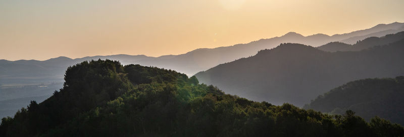 Scenic view of mountains against sky during sunset