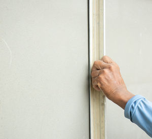 Close-up of hand holding door 