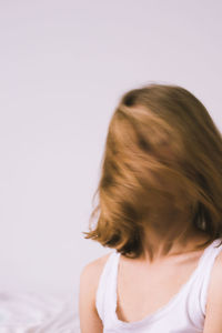 Rear view of woman against white background