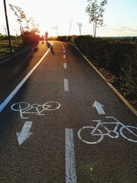 Road sign against sky in city