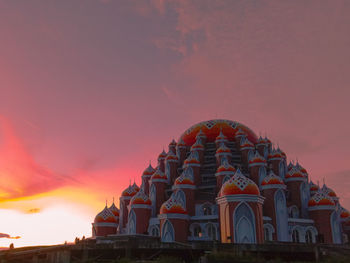 Low angle view of building against sky during sunset