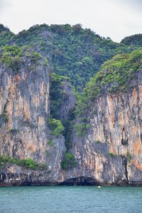 Scenic view of sea and mountains against sky