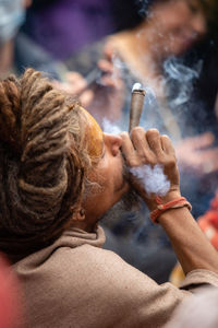 Close-up of man smoking cigarette