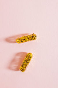 High angle view of dentures over white background