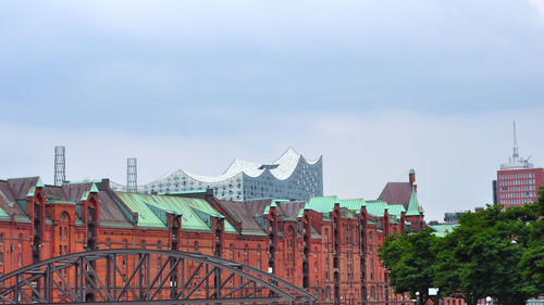 Buildings in city against sky