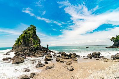 Scenic view of sea against blue sky