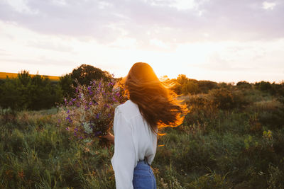 Healing power of nature, benefits of ecotherapy, nature impact wellbeing. happy young girl holding