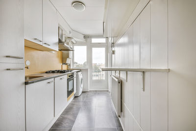 Empty corridor of modern kitchen