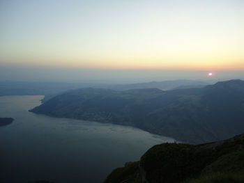 Scenic view of mountains against sky during sunset