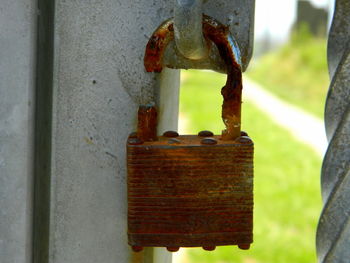 Close-up of padlock on metal