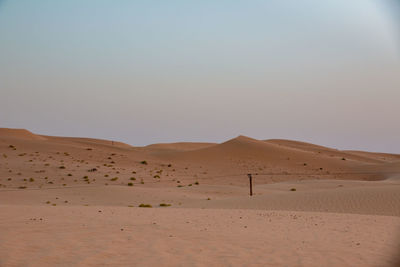 Scenic view of desert against clear sky