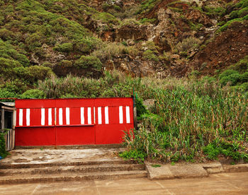 Close-up of red mailbox on wall