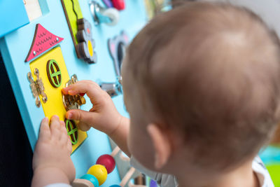 Close-up of boy playing with toys
