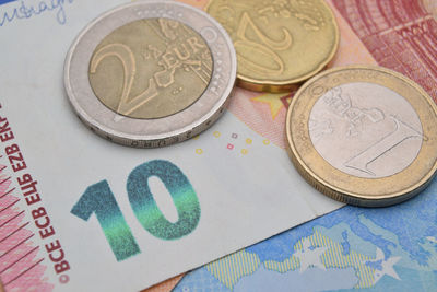 Close-up of coins on paper