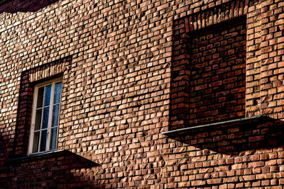 Low angle view of brick wall in building