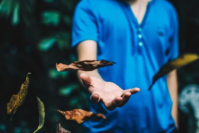 Woman holding leaves