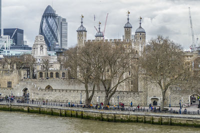 View of buildings against cloudy sky