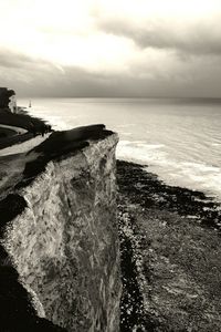 Scenic view of sea against cloudy sky