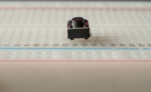 Close-up of telephone booth on table