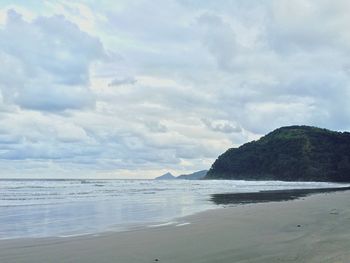 Scenic view of sea against cloudy sky