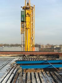 Roof being rebuild after fire against sky